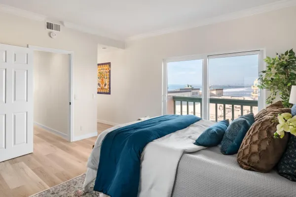 a bedroom with a bed and a couch