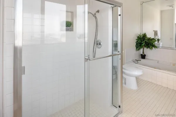 a bathroom with double vanity sink and a mirror