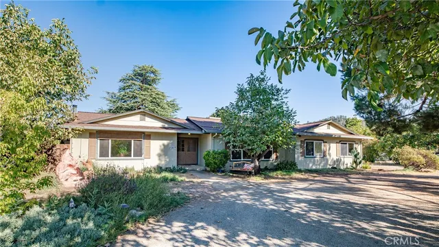 a kitchen with stainless steel appliances granite countertop a stove and cabinets
