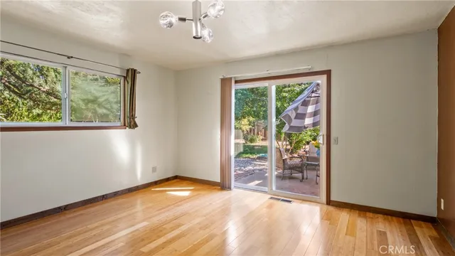 an aerial view of a house with a yard and trees