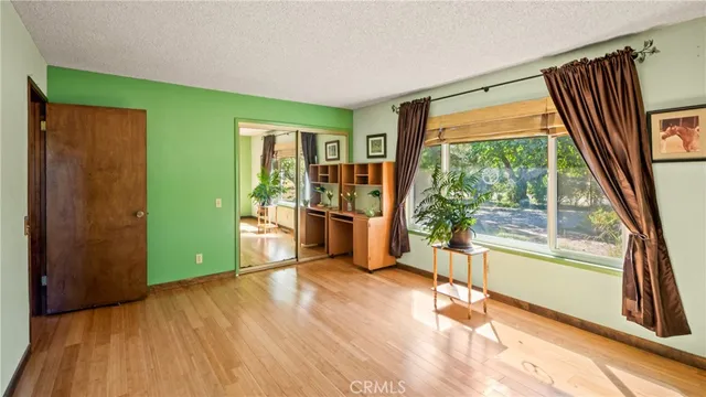 a view of outdoor space with swimming pool and trees