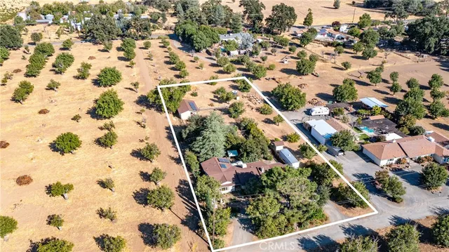 a view of a house with a snow in the yard