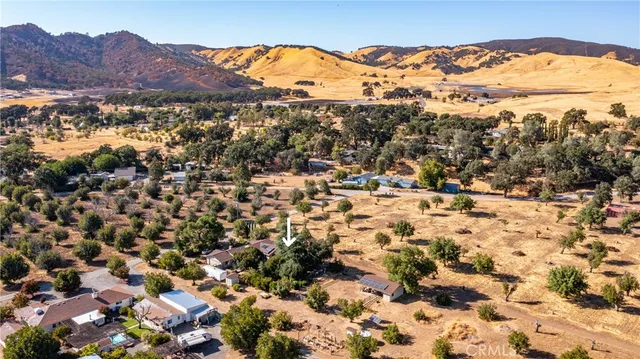 a kitchen with granite countertop a refrigerator stove and microwave