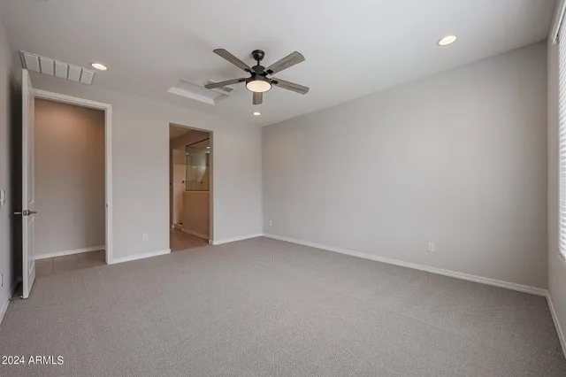 a bathroom with a double vanity sink mirror and shower