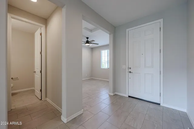 a view of a hallway with staircase