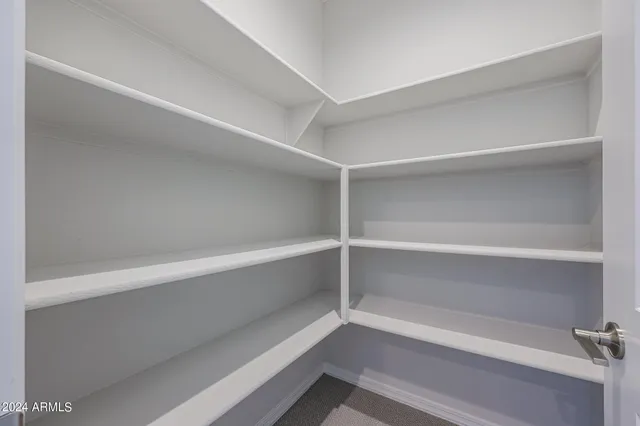 a view of a kitchen with a sink and a window