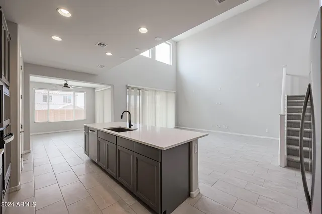 a view of a kitchen with a sink and cabinets