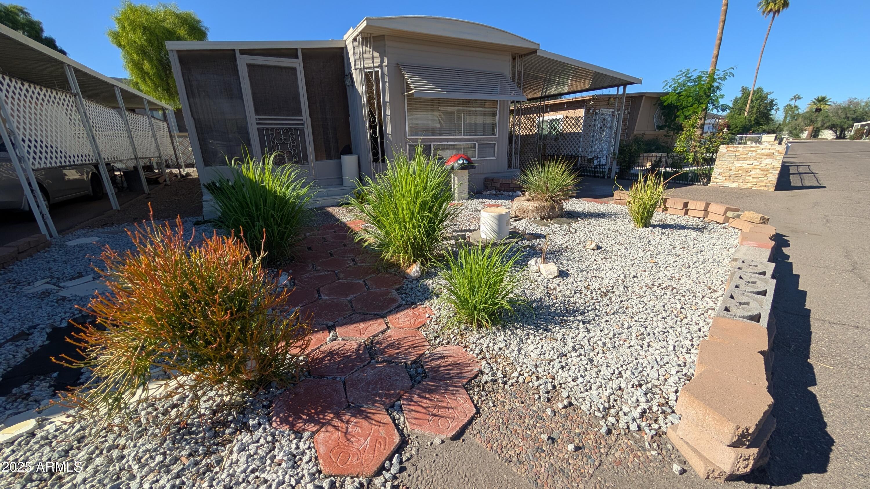 1250 East Bell Road, Unit 23 Phoenix, AZ 85022 - Photo 1 of 26 a view of a backyard with plants and patio