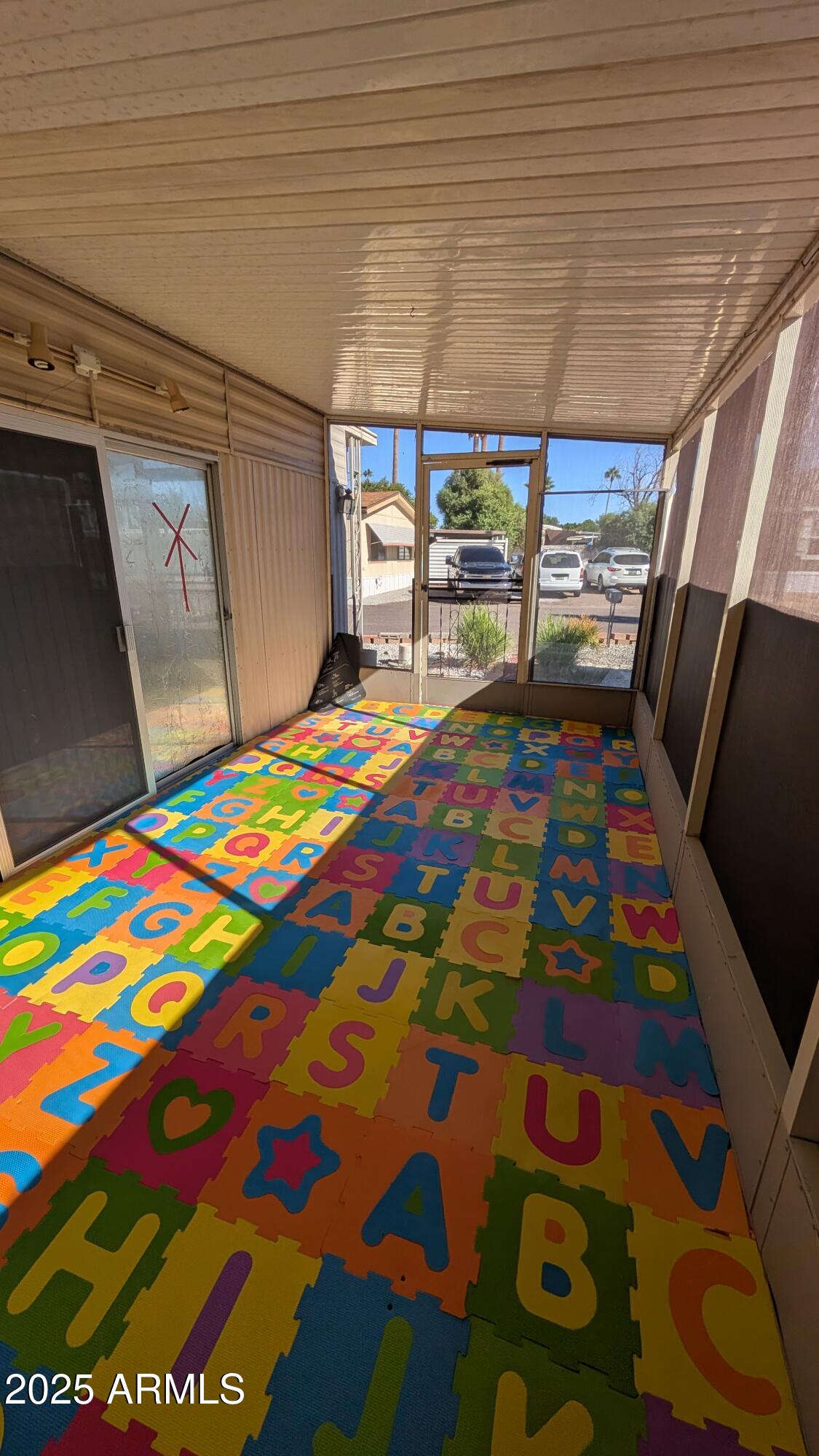 1250 East Bell Road, Unit 23 Phoenix, AZ 85022 - Photo 16 of 26 a bedroom with a bed and a table