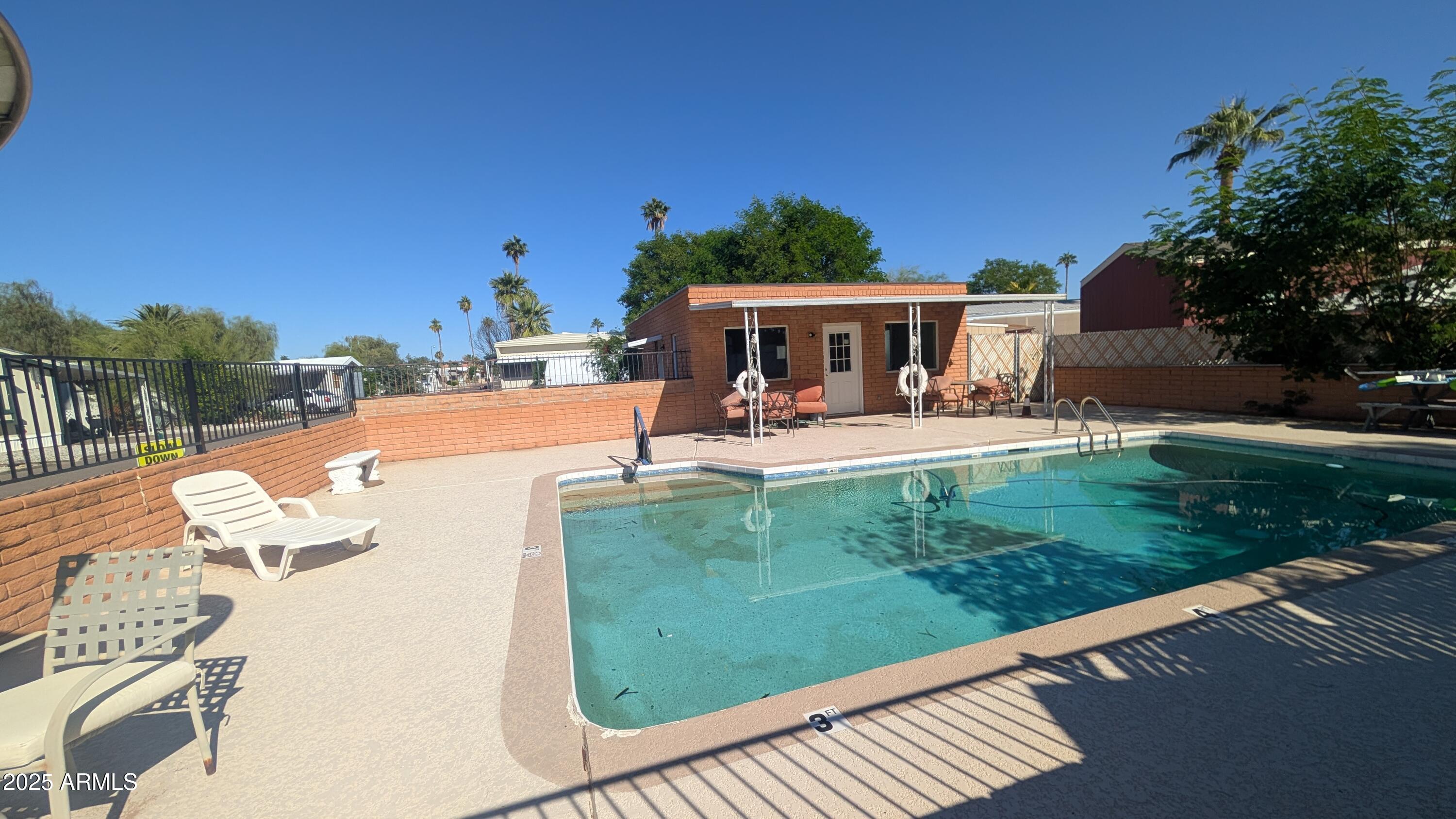 1250 East Bell Road, Unit 23 Phoenix, AZ 85022 - Photo 26 of 26 a view of a house with backyard sitting area and garden
