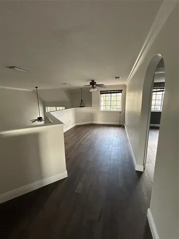a view of a kitchen with a sink dishwasher and a fireplace
