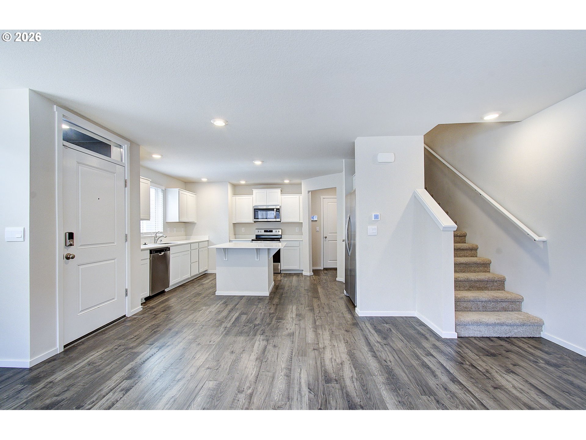 17402 Northwest 10th Place Ridgefield, WA 98642 - Photo 13 of 36 a open kitchen with white cabinets and white appliances