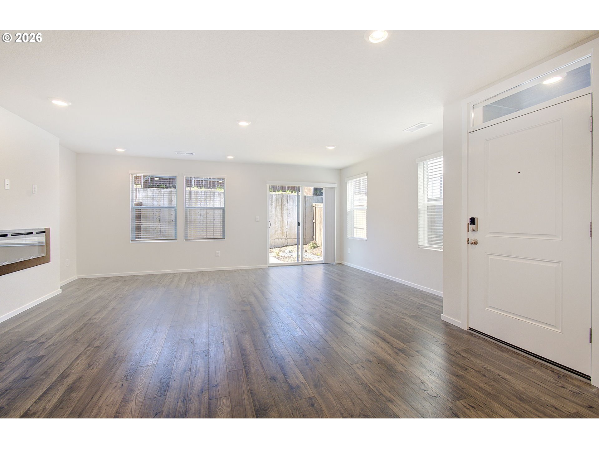 17402 Northwest 10th Place Ridgefield, WA 98642 - Photo 25 of 36 a view of an empty room with a window and wooden floor