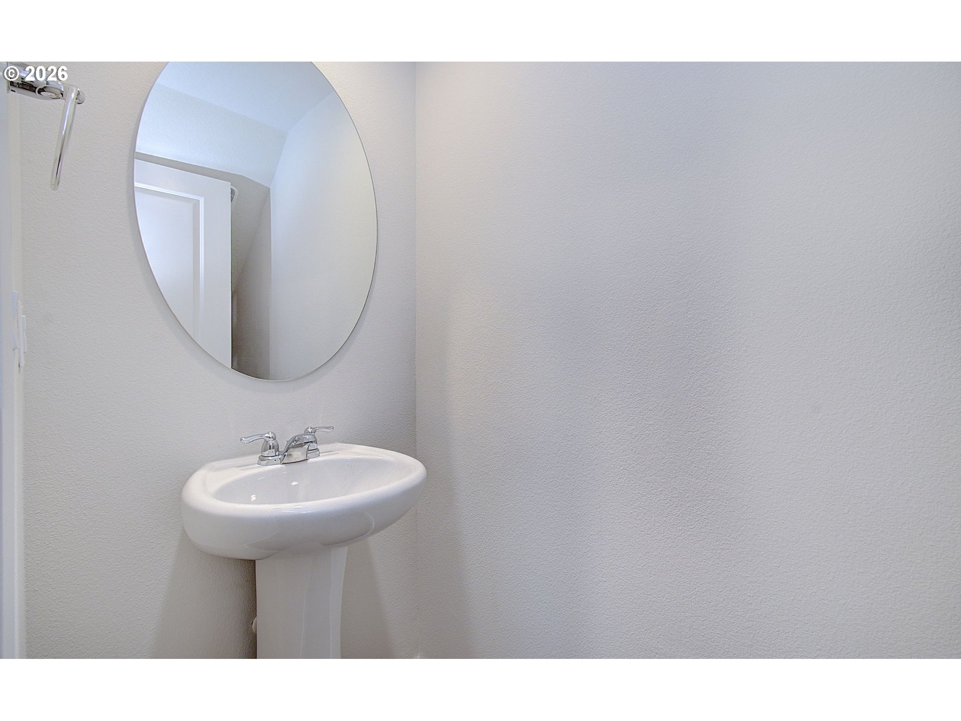 17402 Northwest 10th Place Ridgefield, WA 98642 - Photo 26 of 36 a bathroom with a sink a mirror and vanity