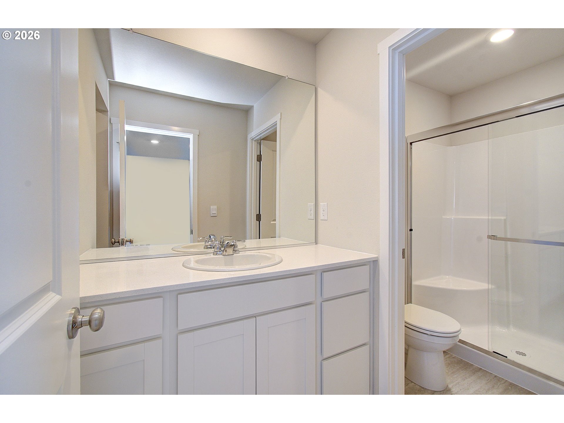 17402 Northwest 10th Place Ridgefield, WA 98642 - Photo 28 of 36 a bathroom with a sink a toilet and shower