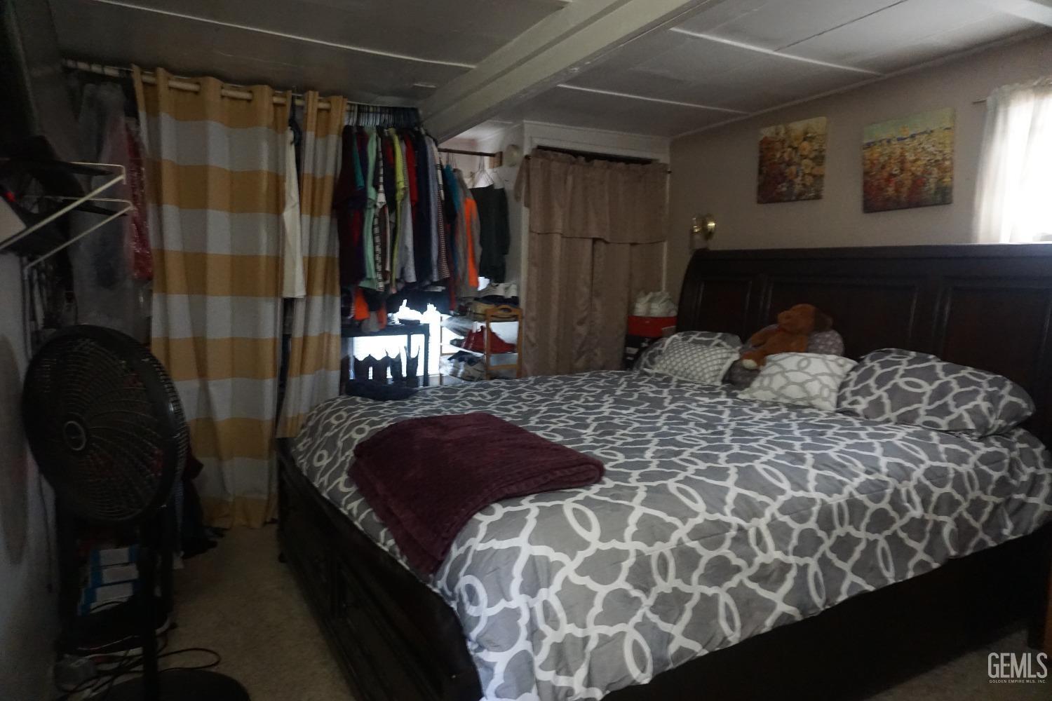 Undisclosed Address Bakersfield, CA 93306 - Photo 12 of 12 a bedroom with a bed and a window