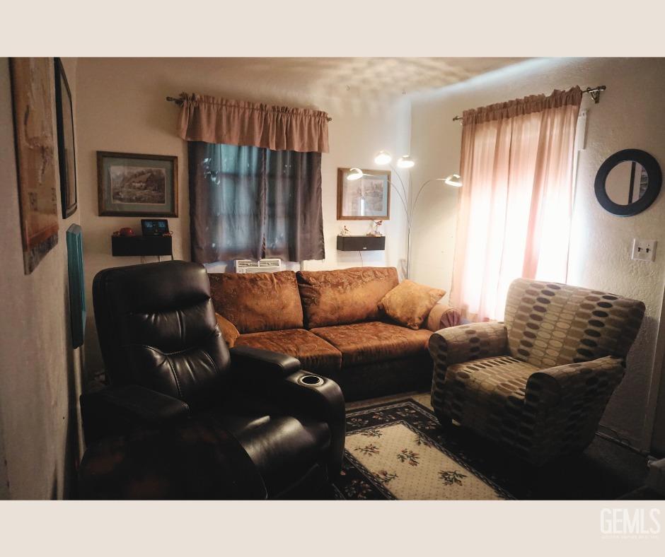 Undisclosed Address Bakersfield, CA 93306 - Photo 3 of 12 a living room with furniture and a large window