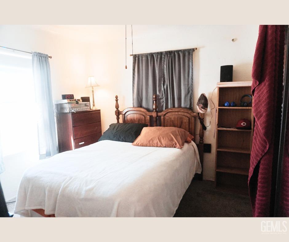 Undisclosed Address Bakersfield, CA 93306 - Photo 4 of 12 a bedroom with bed and a flat tv screen