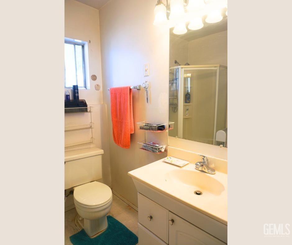 Undisclosed Address Bakersfield, CA 93306 - Photo 6 of 12 a bathroom with a sink toilet and shower