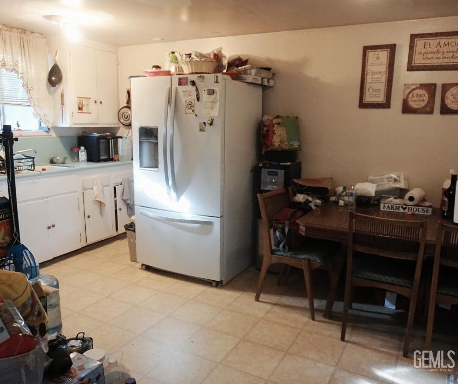 Undisclosed Address Bakersfield, CA 93306 - Photo 10 of 12 a kitchen with stainless steel appliances granite countertop a refrigerator and a stove top oven
