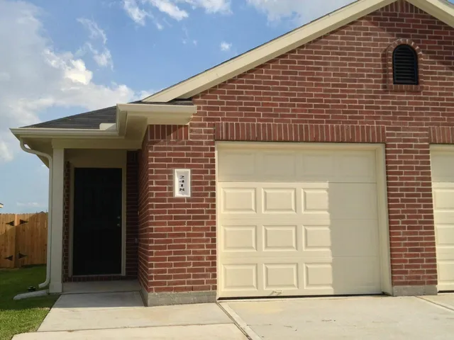 a kitchen with a stove a sink and a microwave