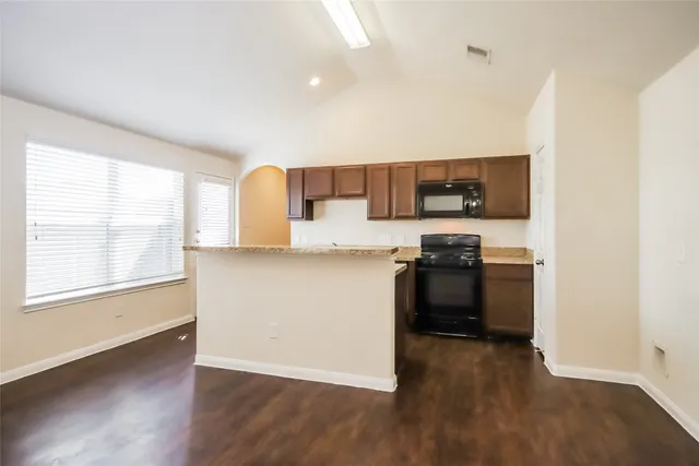 a view of kitchen with wooden floor