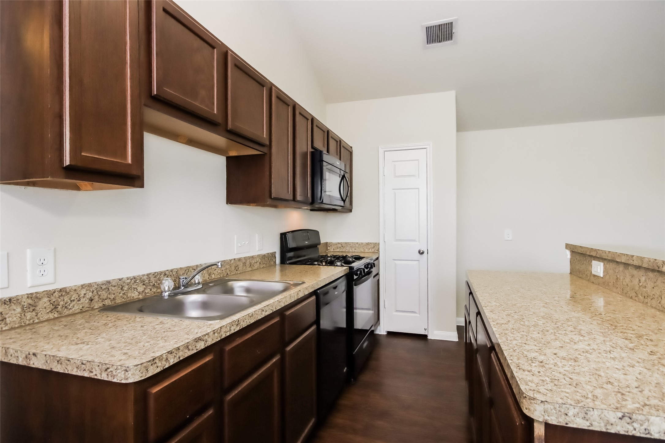 2418 High Island Way, Unit A Houston, TX 77073 - Photo 7 of 14 a kitchen with stainless steel appliances granite countertop a sink stove and cabinets