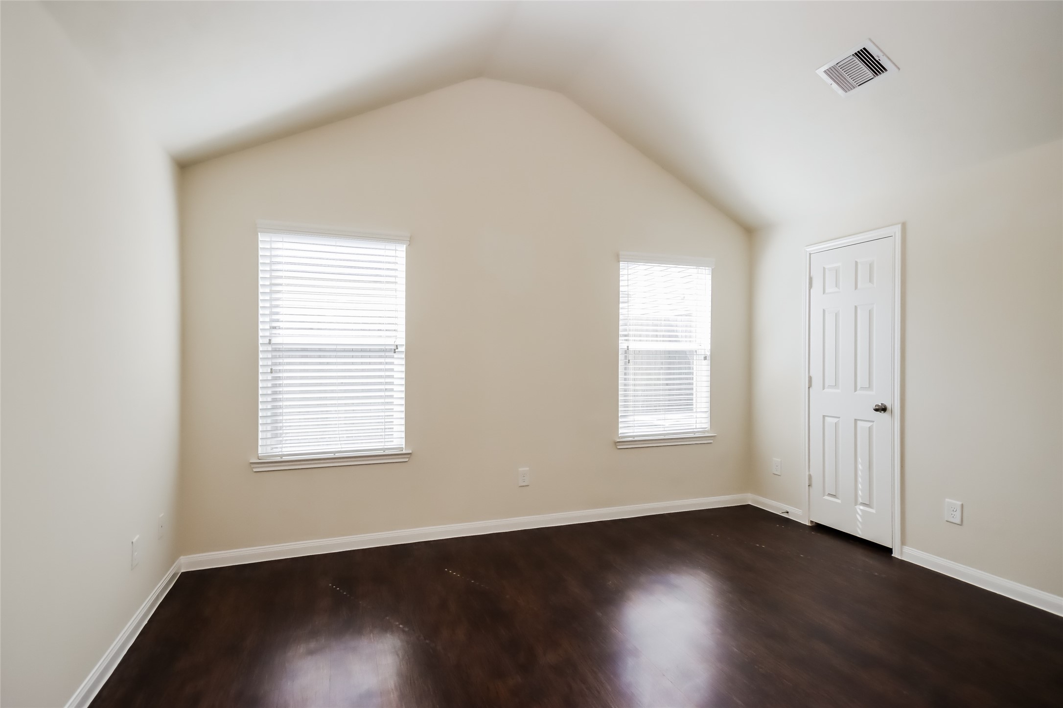 2418 High Island Way, Unit A Houston, TX 77073 - Photo 9 of 14 an empty room with wooden floor and windows
