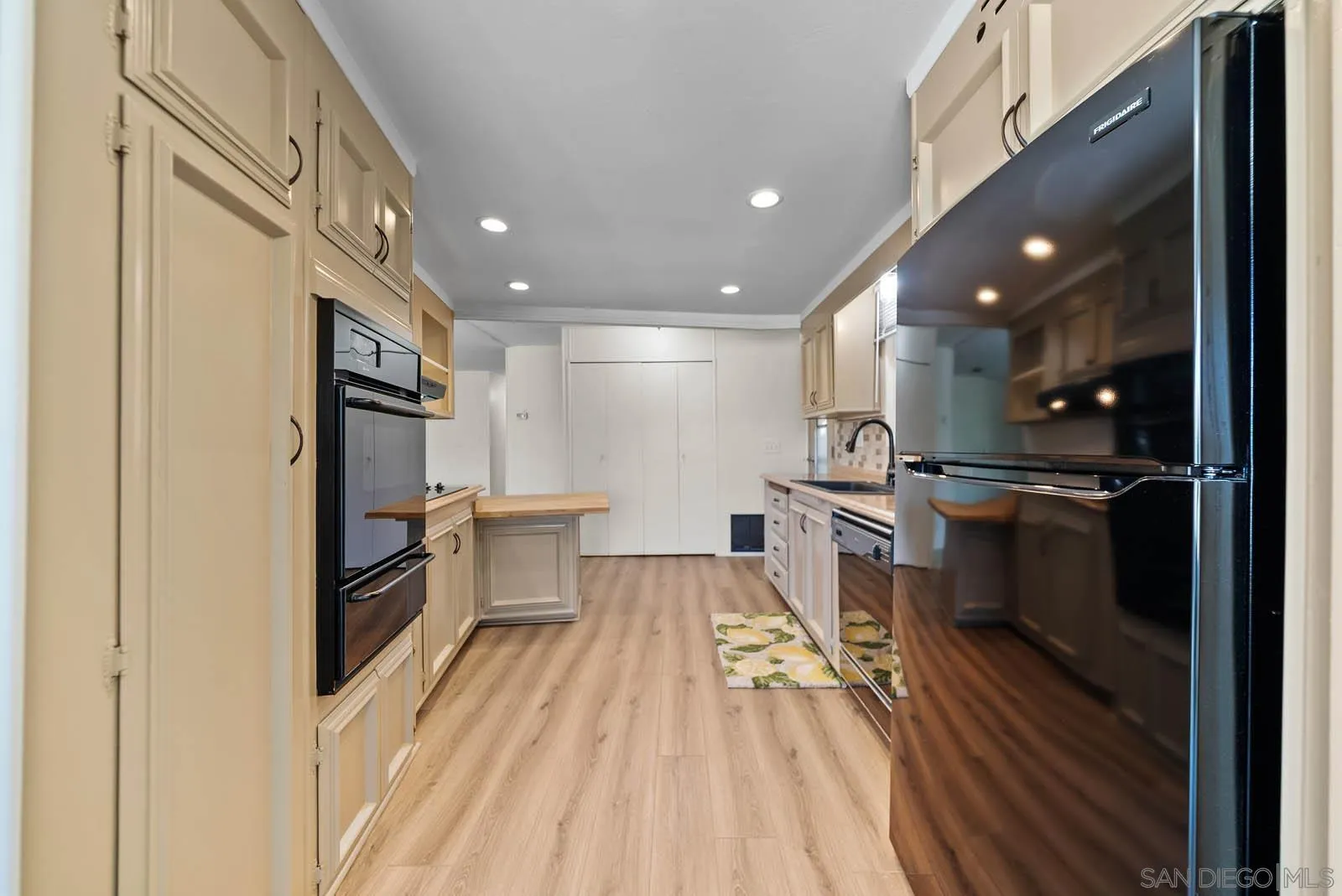 9500 Harritt Road, Unit 198 Lakeside, CA 92040 - Photo 24 of 48 a kitchen with refrigerator and cabinets