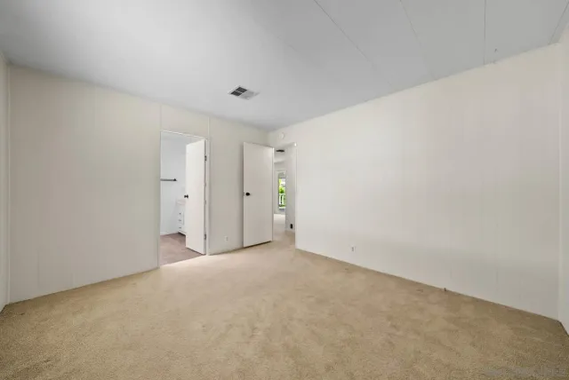 a bathroom with a shower sink and mirror