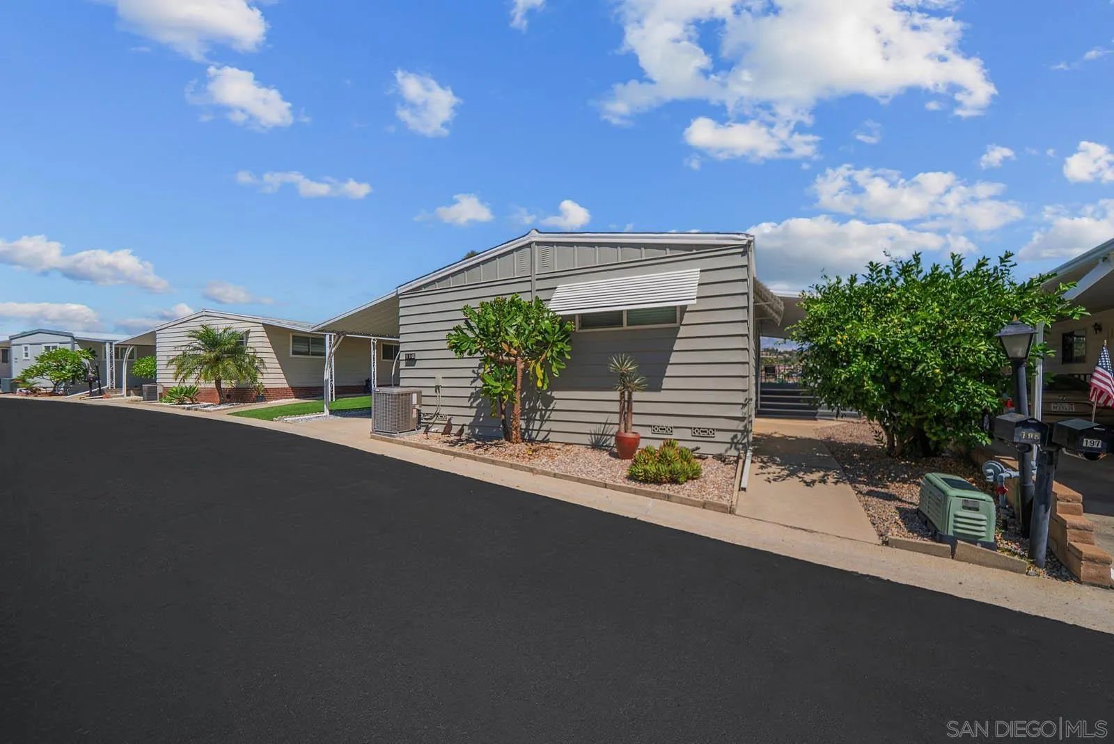 9500 Harritt Road, Unit 198 Lakeside, CA 92040 - Photo 3 of 48 a front view of a house with a garden