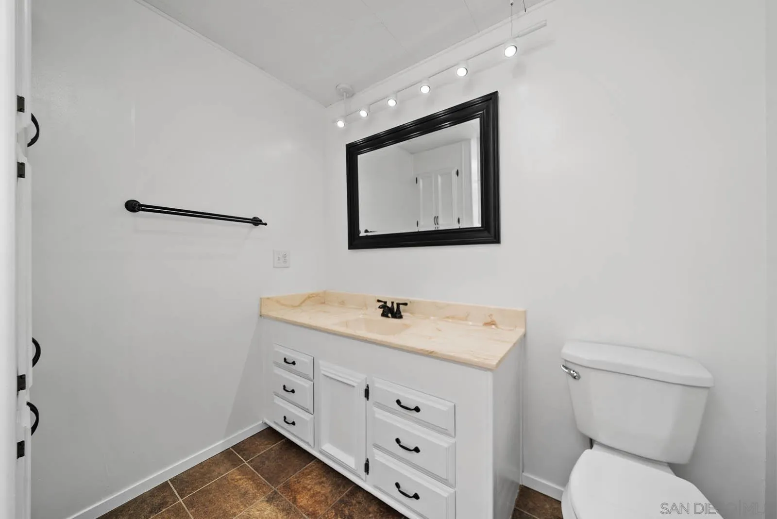 9500 Harritt Road, Unit 198 Lakeside, CA 92040 - Photo 31 of 48 a bathroom with a toilet sink and mirror