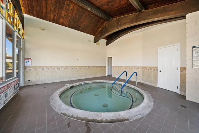 a view of a livingroom with furniture and a bookshelf