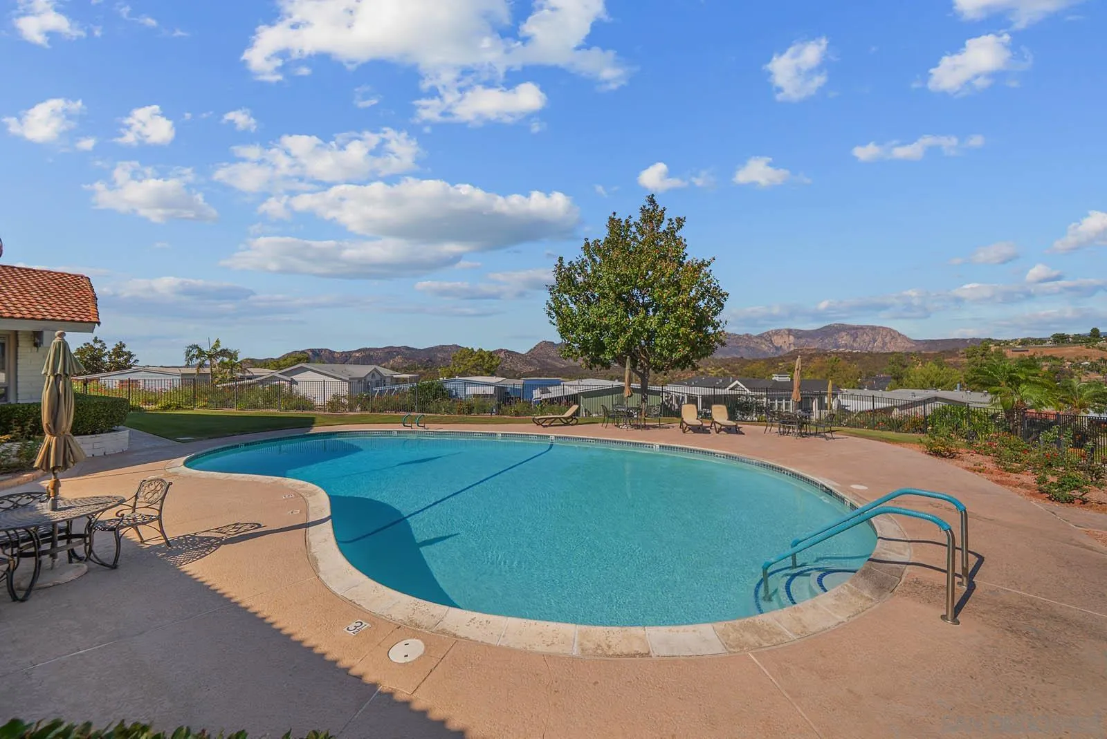 9500 Harritt Road, Unit 198 Lakeside, CA 92040 - Photo 44 of 48 a view of a swimming pool and lounge chair