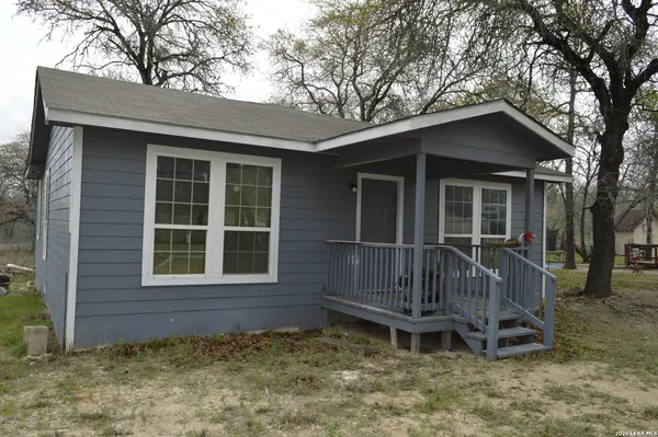 a house with trees in the background