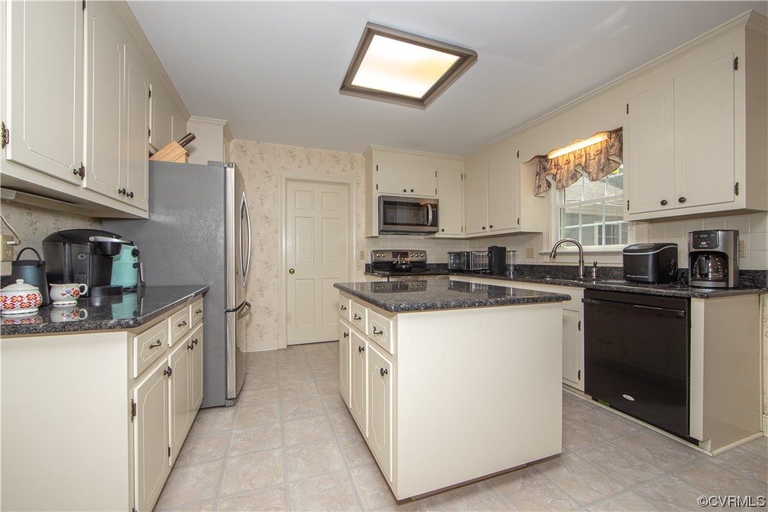 2620 Salisbury Road Midlothian, VA 23113 - Photo 11 of 36 a kitchen with stainless steel appliances granite countertop a stove top oven a sink a refrigerator and white cabinets
