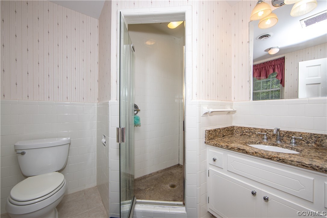 2620 Salisbury Road Midlothian, VA 23113 - Photo 21 of 36 a bathroom with a granite countertop toilet and a sink