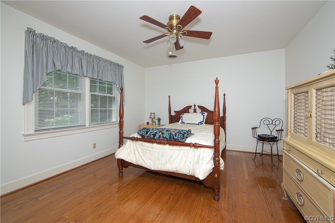 2620 Salisbury Road Midlothian, VA 23113 - Photo 23 of 36 a bedroom with a bed and wooden floor