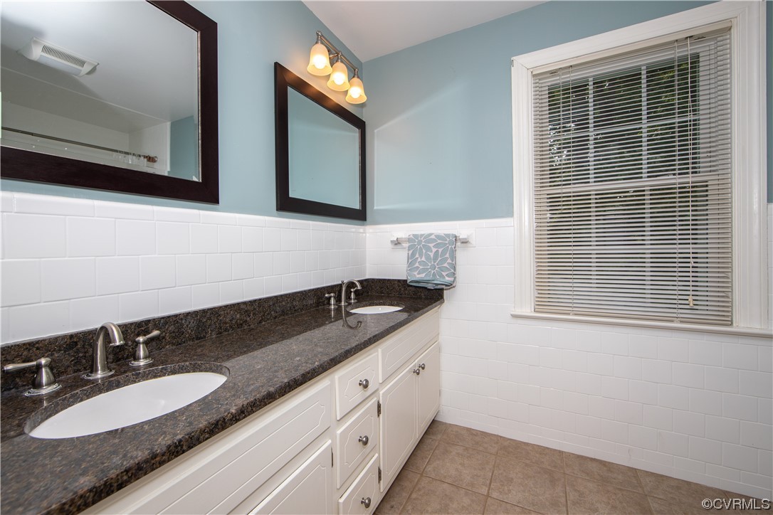 2620 Salisbury Road Midlothian, VA 23113 - Photo 24 of 36 a bathroom with a granite countertop double vanity sink and mirror