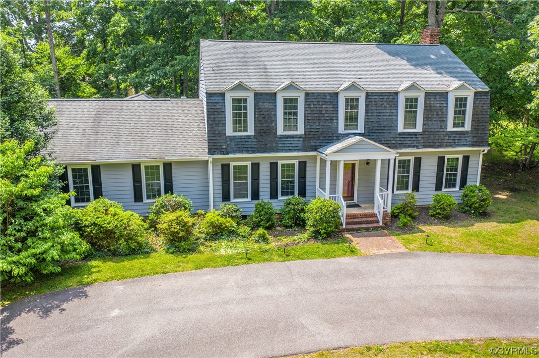 2620 Salisbury Road Midlothian, VA 23113 - Photo 31 of 36 a front view of a house with a yard and potted plants