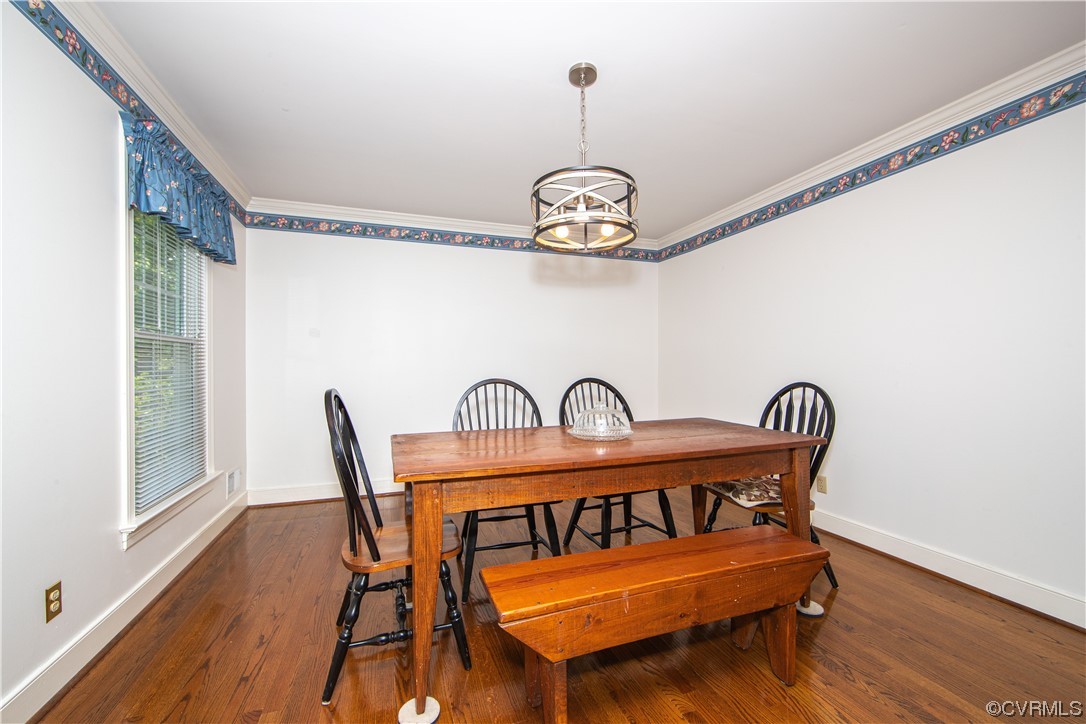 2620 Salisbury Road Midlothian, VA 23113 - Photo 9 of 36 a view of a dining room with furniture wooden floor and chandelier