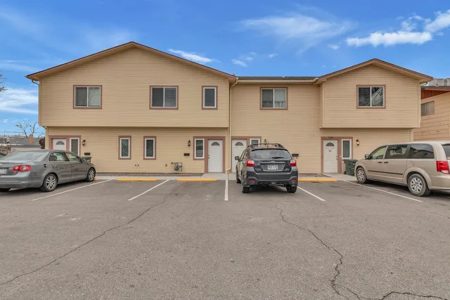 a view of a car parked in front of a house