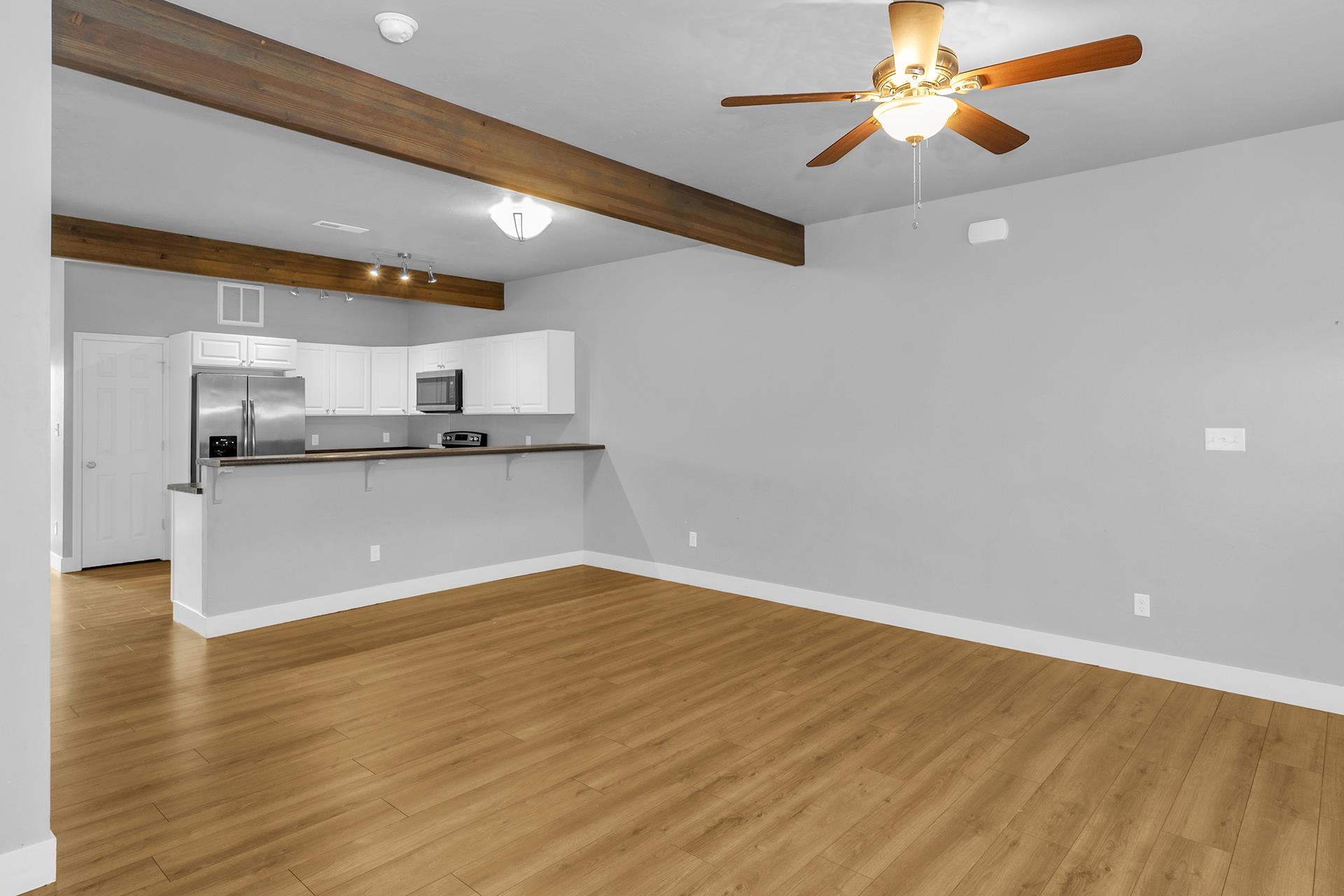 1309 North 16th Street, Unit 3 Grand Junction, CO 81501 - Photo 7 of 25 a view of a kitchen with a sink and a chandelier fan
