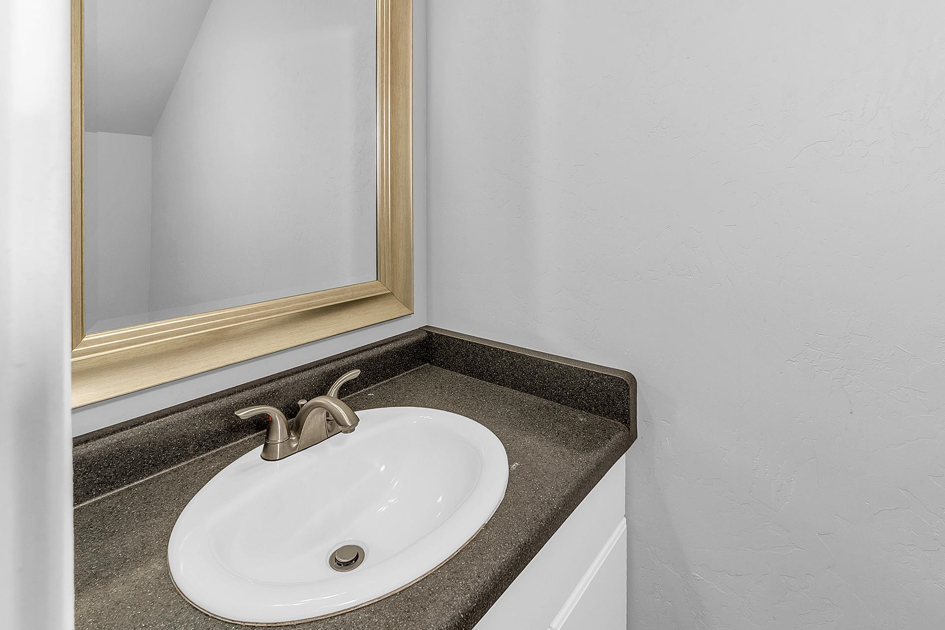 1309 North 16th Street, Unit 3 Grand Junction, CO 81501 - Photo 8 of 25 a bathroom with a sink and a mirror