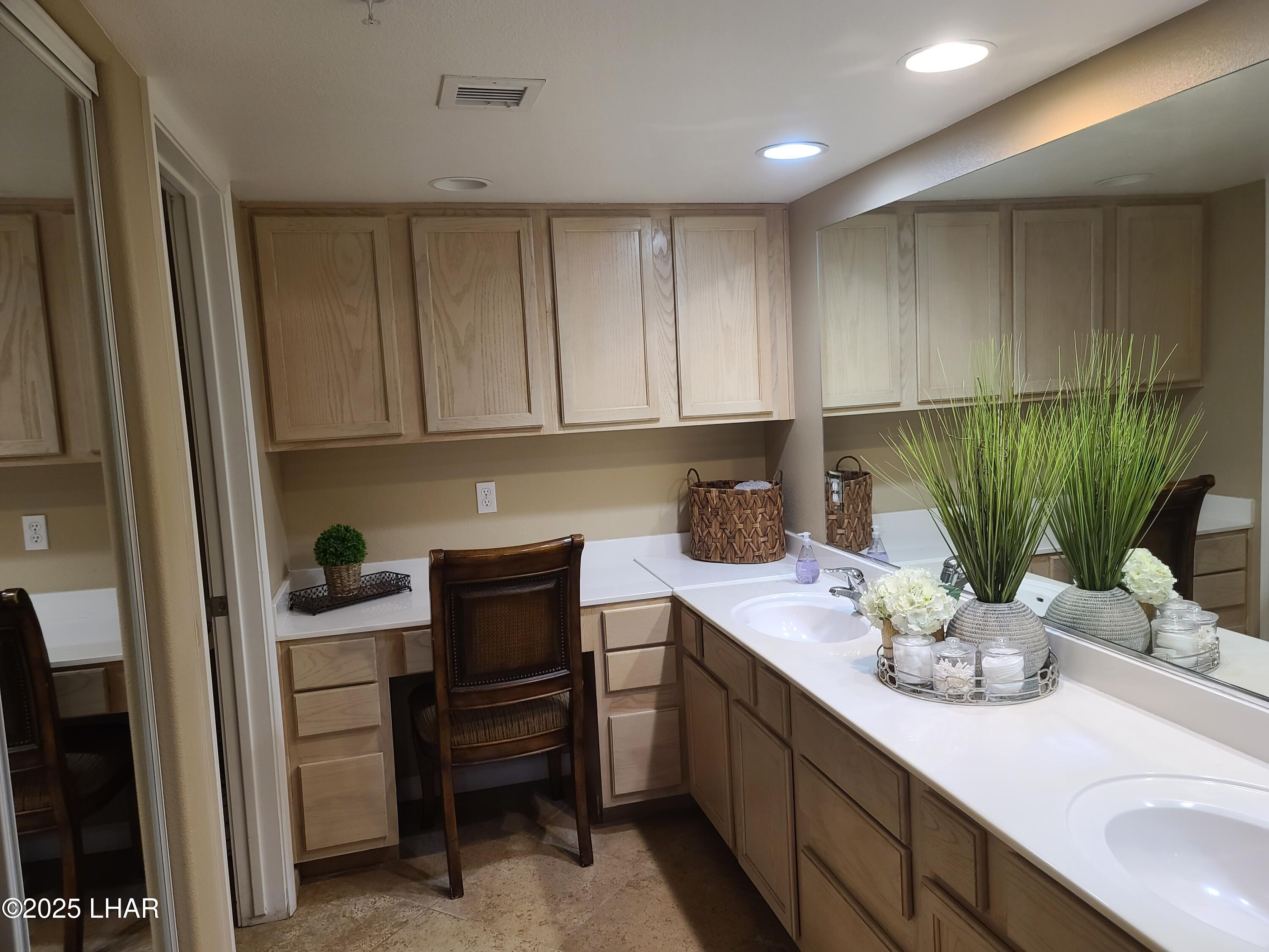 94 London Bridge Road, Unit 108 Lake Havasu City, AZ 86403 - Photo 17 of 38 a kitchen with a sink and cabinets