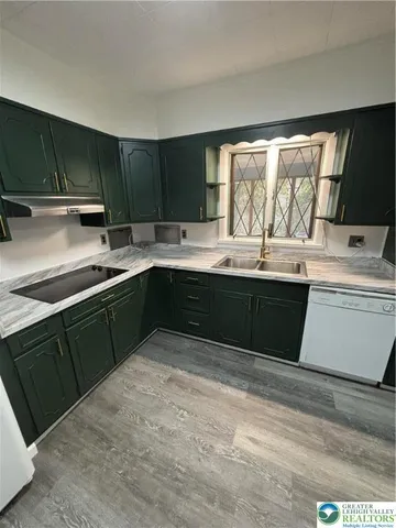 a kitchen with a sink and cabinets