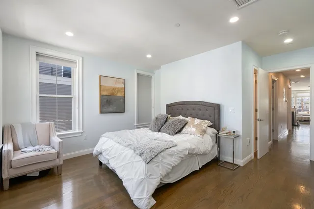 a bedroom with a bed and a couch