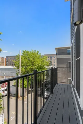 a view of a balcony with wooden floor
