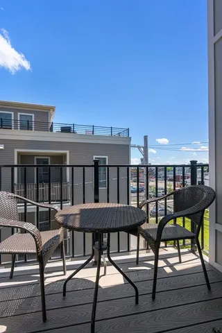a view of a chairs and table on the deck