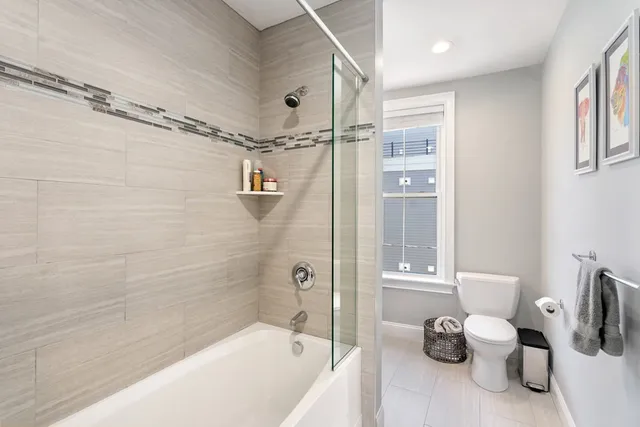 a bathroom with a tub and a shower